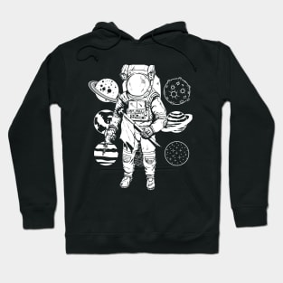 Astronaut wandering between planets Hoodie